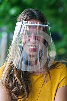 beautiful young woman wearing a protective visor