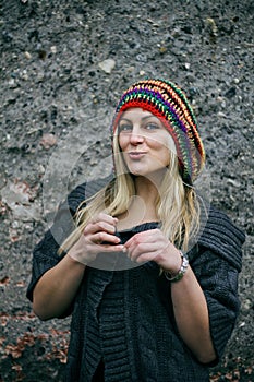 Beautiful young woman wearing rastafarian hat