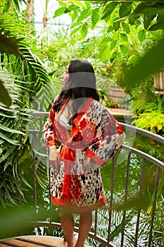 Beautiful young woman wearing summer clothes on tropical resort