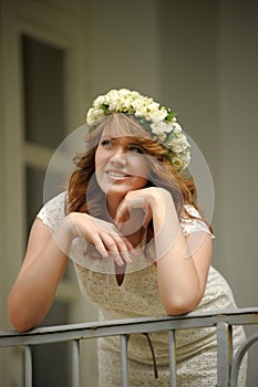 Beautiful young woman wearing a wreath