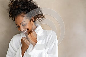 African young woman in bath robe at spa photo