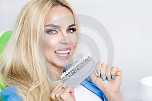 Beautiful, young woman with white and healthy teeth, she smiles. He has healthy and whitened teeth and porcelain veneers