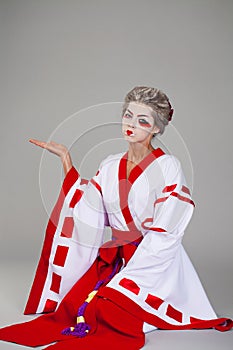 Beautiful young woman in white kimono