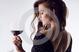 Beautiful young woman with wine glass