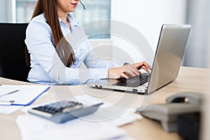 Beautiful young woman working at call center