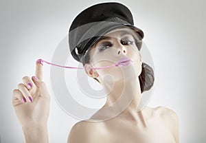 Beautiful young girl pulling bubblegum photo