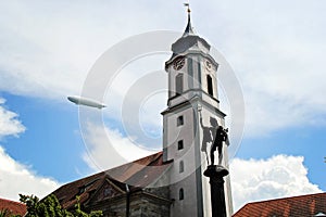 Beautiful Zeppelin Flying Above the Curch in Lindau, Bodensee in