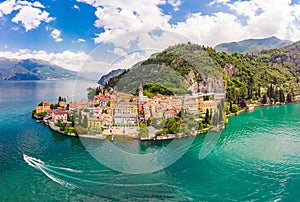 Beautifull aerial panoramic view from the drone to the Varenna - famous old Italy town on bank of Como lake. High top view to