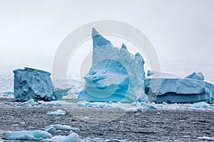 Beautifull big blue iceberg and ocean. Peculiar landscape of Antarctica