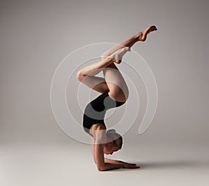 Beautifull flexible blonde girl posing. Gymnastics.