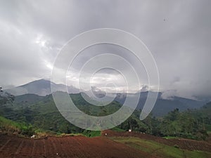beautifull landscape clody of farm and mountain background