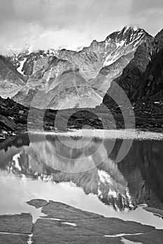 Beautifull valley with view to mountains and lake, black and white