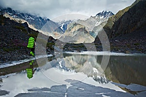 Beautifull valley with view to mountains and lake with hiker