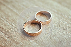 Beautifull wedding rings lie on the table