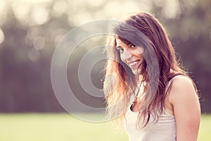 Beautifull young smiling woman with long dark hair.