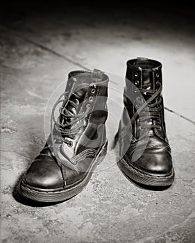 Beautifully aged black leather lace up boots photo