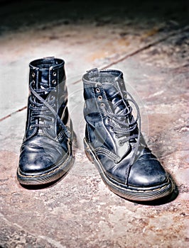 Beautifully aged black leather lace up boots photo