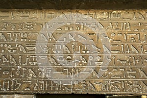 Beautifully carved hieroglyphs above the entrace to the Mastaba of Qar in Cairo in Egypt. photo