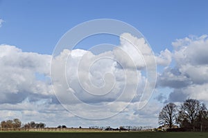 Beautifully cloudy spring skies over cultivated landscape