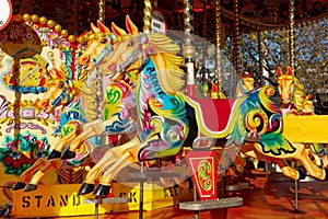 Beautifully decorated carousal horses on a merry-go-round