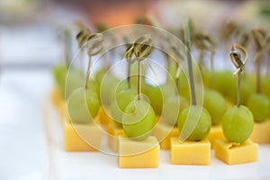 Beautifully decorated catering banquet table with different food snacks and appetizers