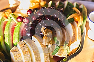 Beautifully decorated catering banquet table with different food snacks and appetizers on corporate christmas birthday party event