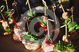 Beautifully decorated catering banquet table with different food snacks and appetizers on corporate christmas birthday party event