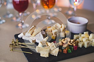 Beautifully decorated catering banquet table with different food snacks and appetizers on corporate christmas birthday party event