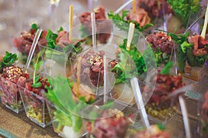 Beautifully decorated catering banquet table with different food snacks and appetizers on corporate christmas birthday party event