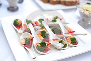 Beautifully decorated catering banquet table with different food snacks and appetizers