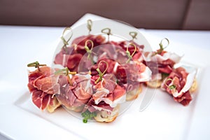 Beautifully decorated catering banquet table with different food snacks and appetizers