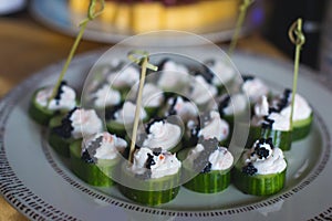 Beautifully decorated catering banquet table with different food snacks and appetizers