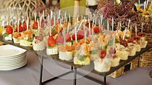 Beautifully decorated catering banquet table with snack canape in restaurant or hotel. catering service, event