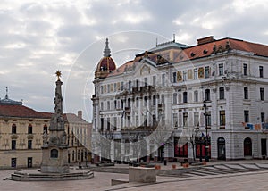 Beautifully decorated County Hall building and Holy Trinity statue on Szechenyi square in city of Pecs Hungary Europe