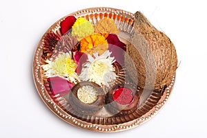 Beautifully Decorated Pooja Thali for festival celebration to worship  rice grain and kumkum  flowers  hindu puja thali