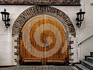 Beautifully decorated portal, door and stone arch