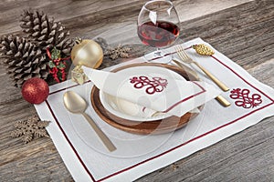 Beautifully decorated table with white plates, glasses, antique cutlery and luxury tablecloths white coral. Christmas table place