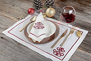 Beautifully decorated table with white plates, glasses, antique cutlery and luxury tablecloths white coral. Christmas table place