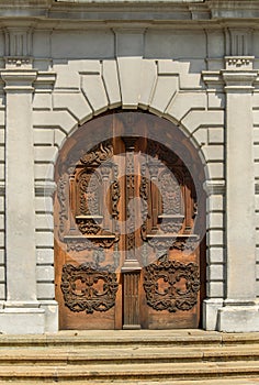 Beautifully decorated wooden door to the church