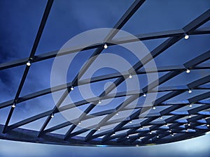 A beautifully designed ceiling with a geometric pattern and lights