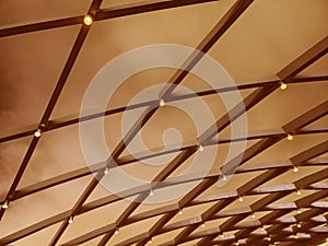 A beautifully designed ceiling with a geometric pattern and lights