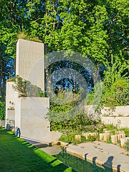 Beautifully designed gardens with plants and variegated flower compositions at RHS Chelsea Flower Show.