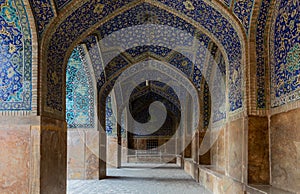 Beautifully ornamented arcade in historical Shah Mosque on south side of Naghsh-e Jahan Square, Isfahan