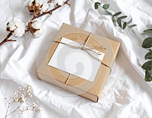 Gift Box with Blank Card on White Fabric