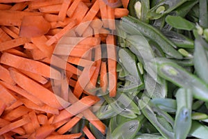 Beautifully sliced carrots, green beans and cabbage to make traditional Indonesian food, namely bakwan