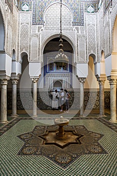 The beautifully tiled interior and fountain of one of the courts in the Mausoleum of Moulay Ismail in Meknes, Morocco.