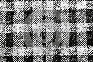 A beautifully woven tweed fabric texture background in a classic black-and-white houndstooth