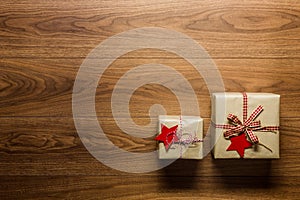 Beautifully wrapped vintage christmas presents on wooden background, view from above