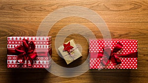 Beautifully wrapped vintage christmas presents on wooden background, view from above