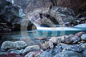 Beautifuly blue water flowing in mountain stream